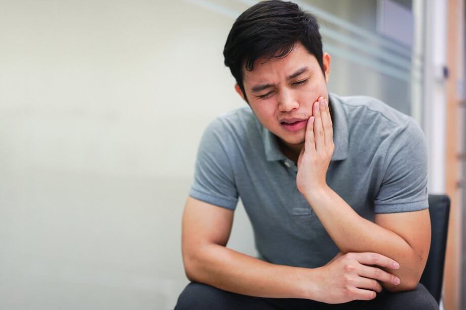 Close-up of Man Experiencing Jaw Pain